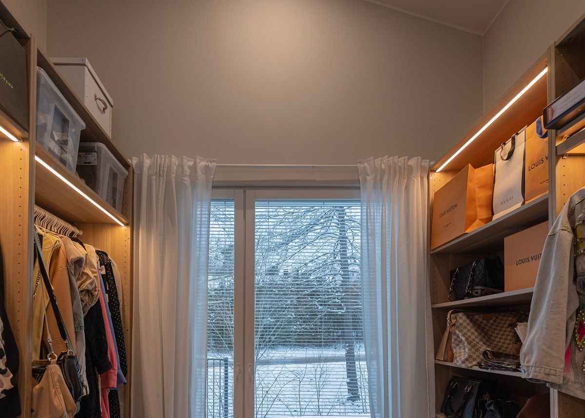 Wardrobe lighting with LED profiles mounted on cabinets.